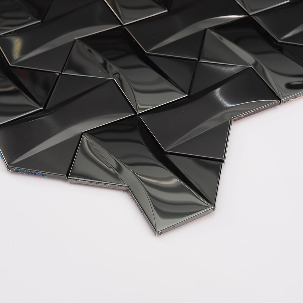 Side angle of glossy black 3D mosaic tiles showing the depth and sharp geometric peaks