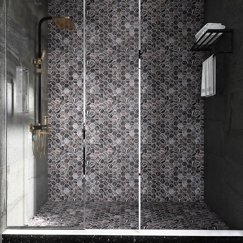 Grey marble hexagon mosaic tiles in a walk-in shower