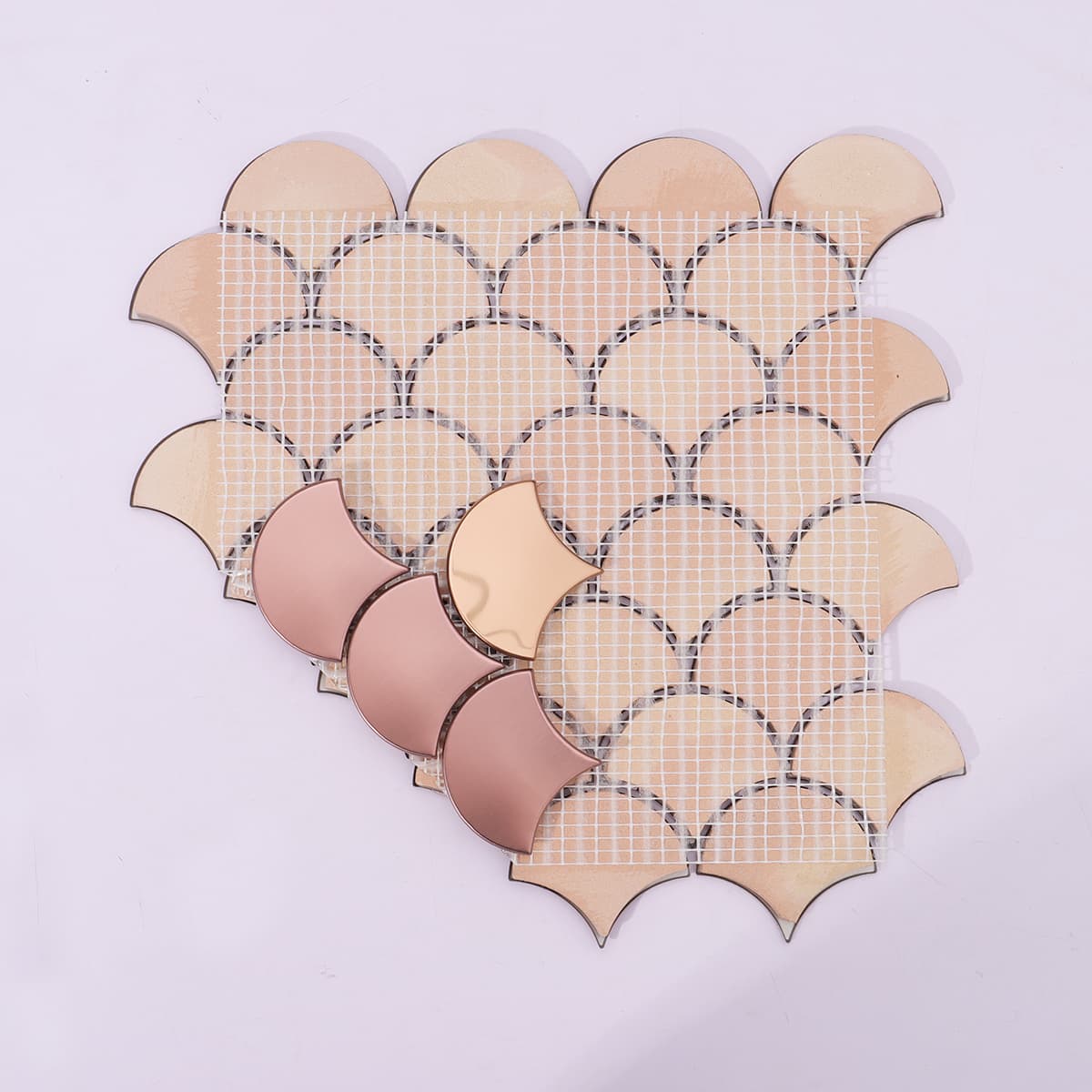 Mesh backing of rose gold fan mosaic tile