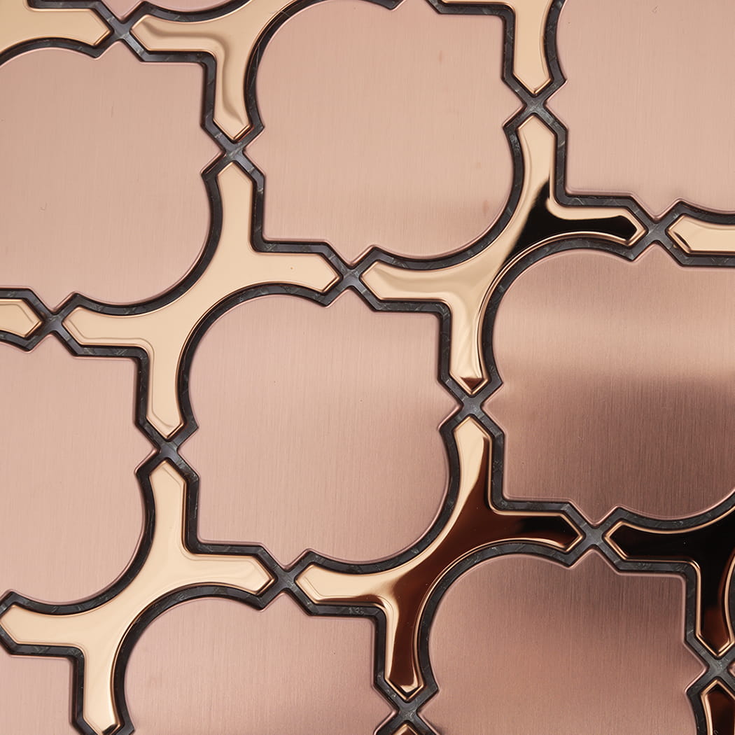 Detailed texture of rose gold metallic mosaic tiles with a brushed surface.