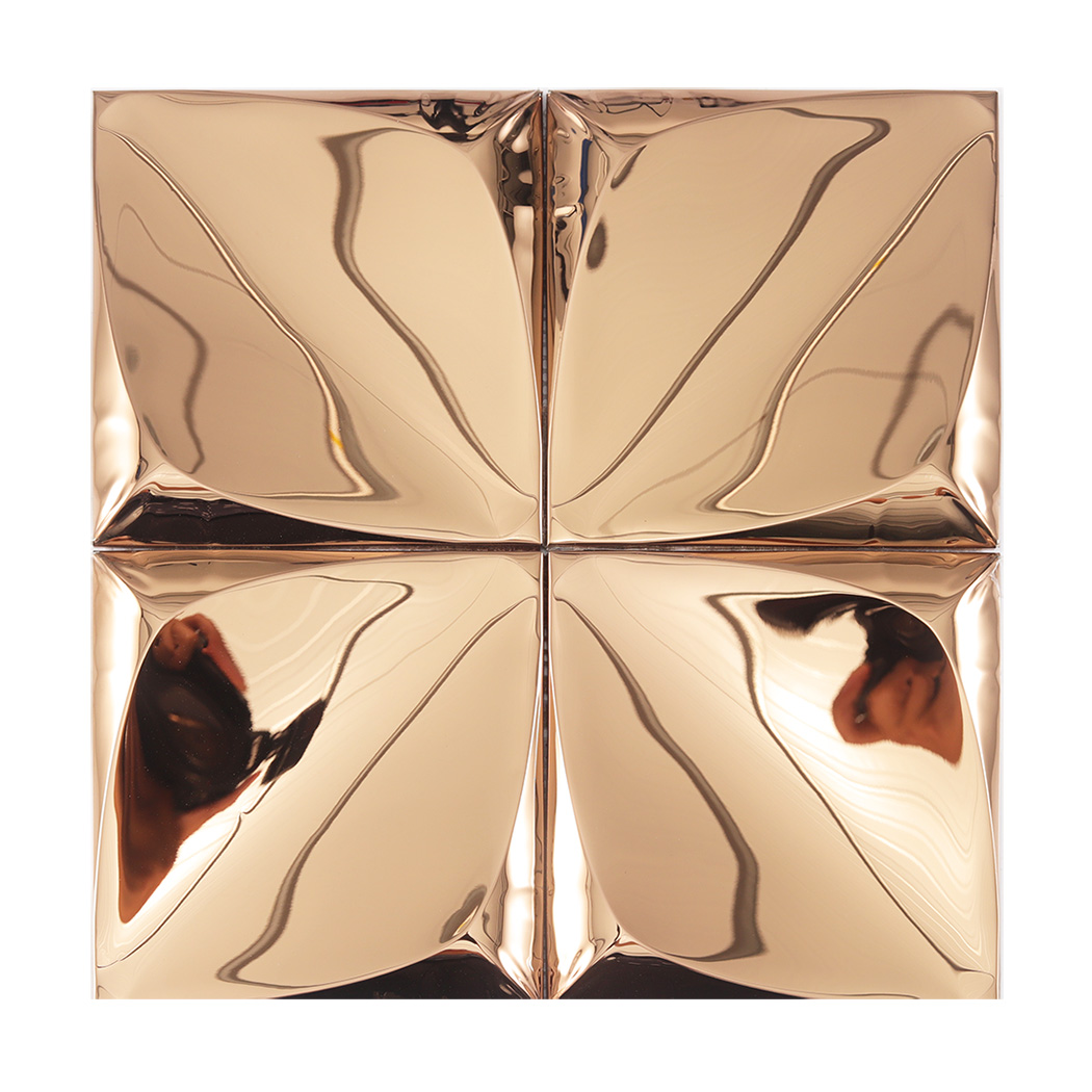 Four square rose gold wall tiles with a 3D leaf-like pattern and a highly reflective mirror finish.
