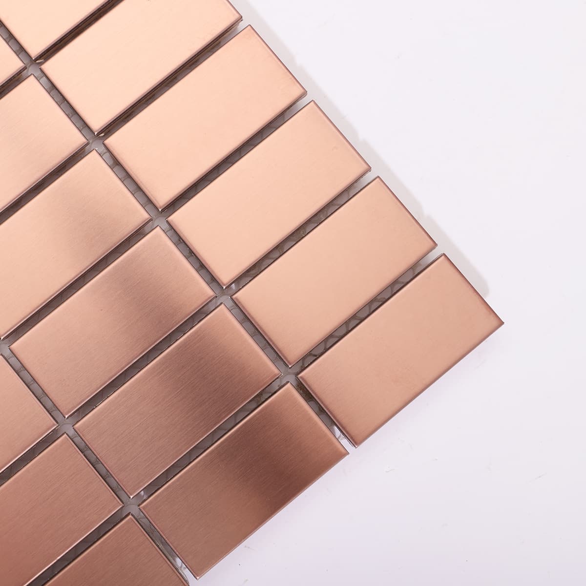 Close-up of rose gold mini brick mosaic tile from corner angle