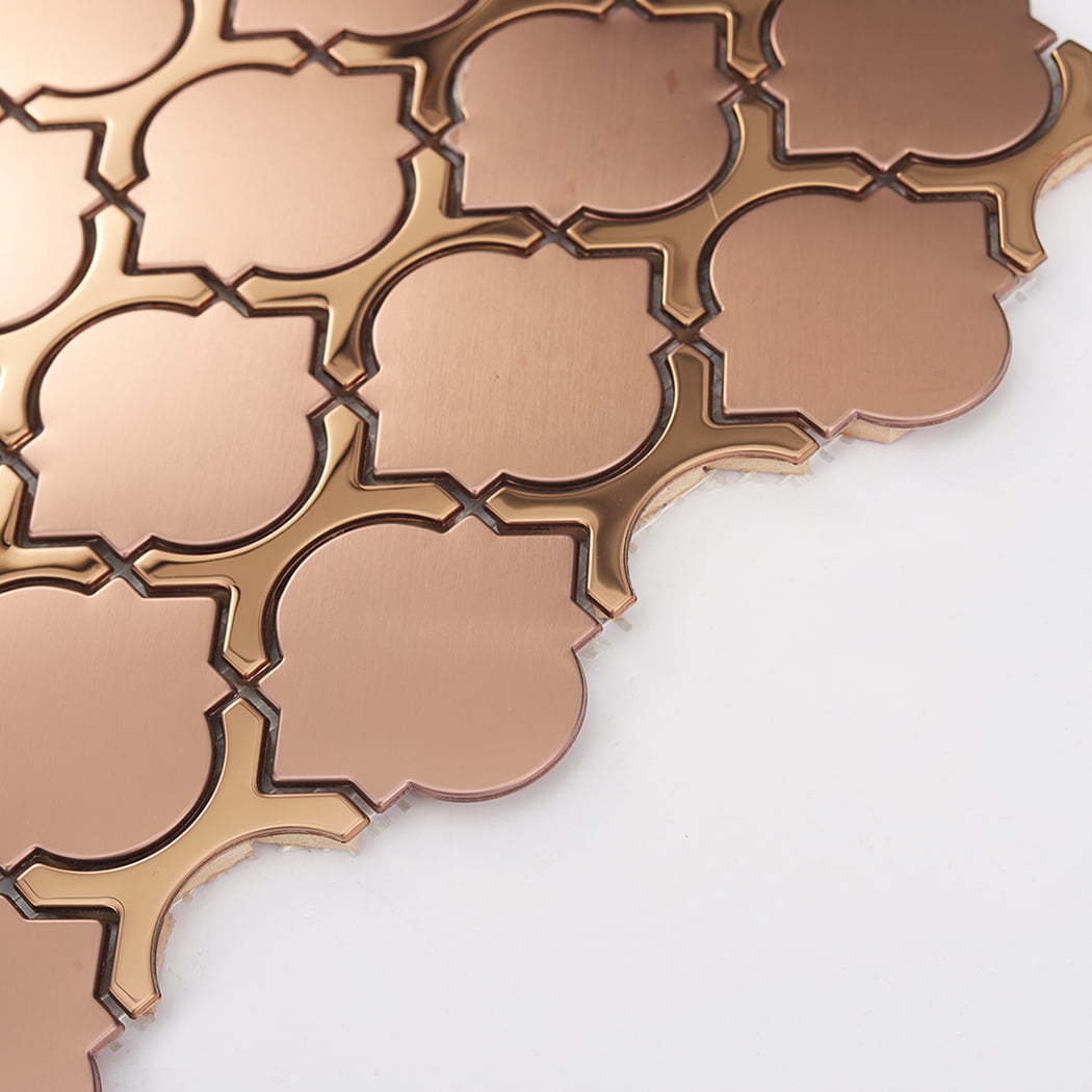 An angled view of a rose gold mosaic tile sheet on a white background.