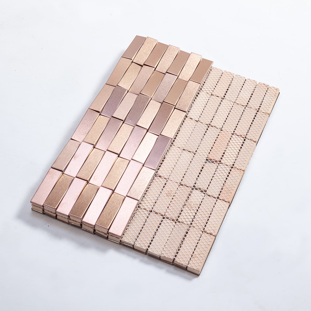 Front and back view of rose gold stainless steel long strip 3D mosaic tile with mesh backing