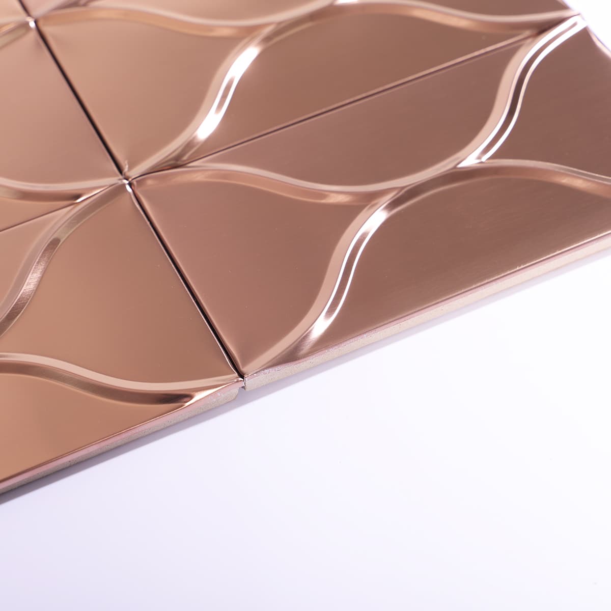 Edge view of rose gold 3D tile showing thickness and layering