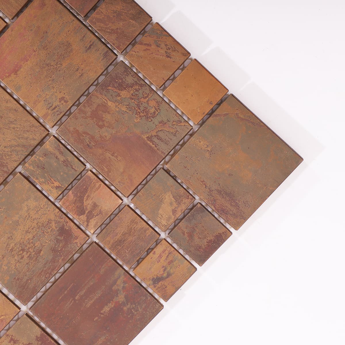 Corner close-up of rustic copper mosaic tiles