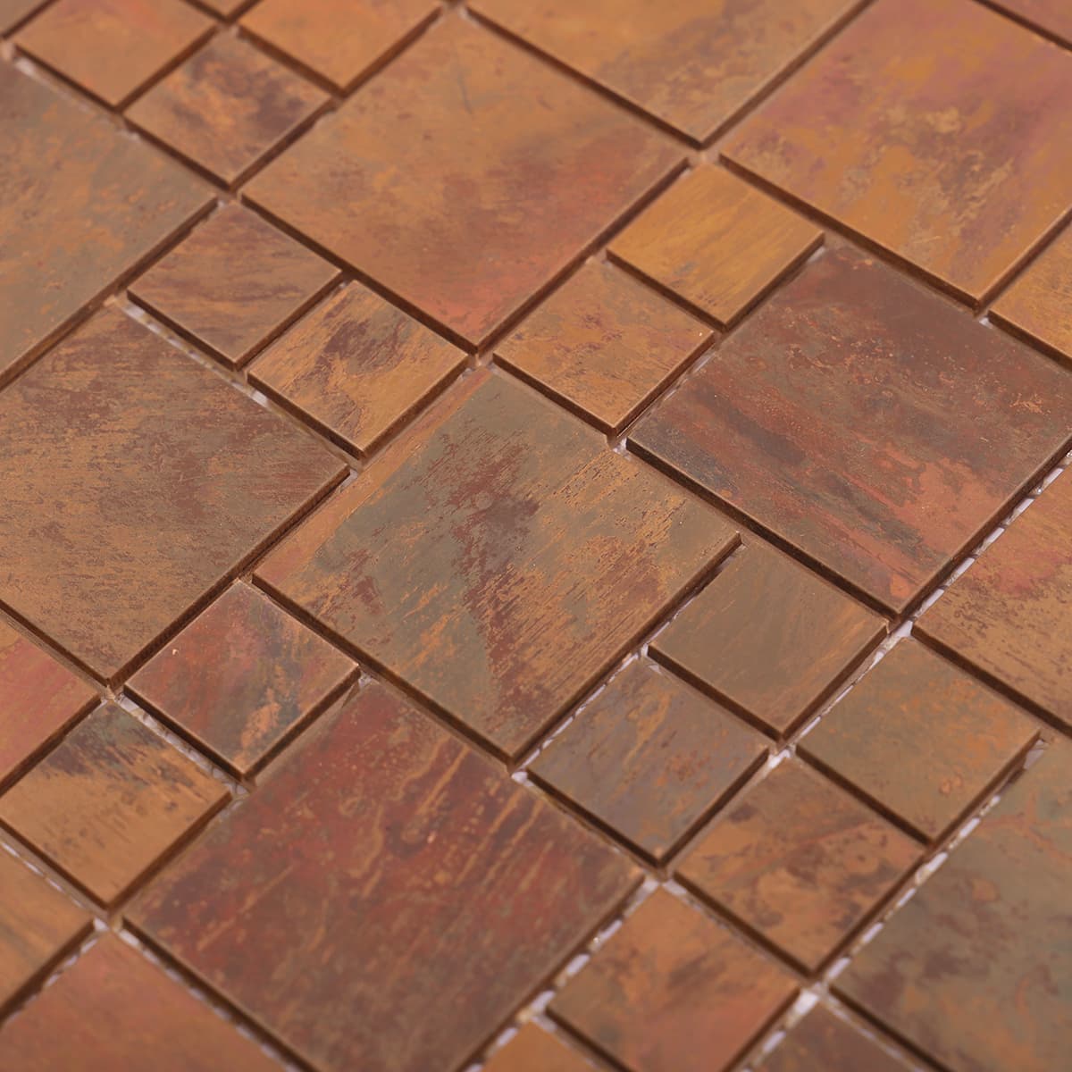 Detailed view of red copper mosaic tile texture and color