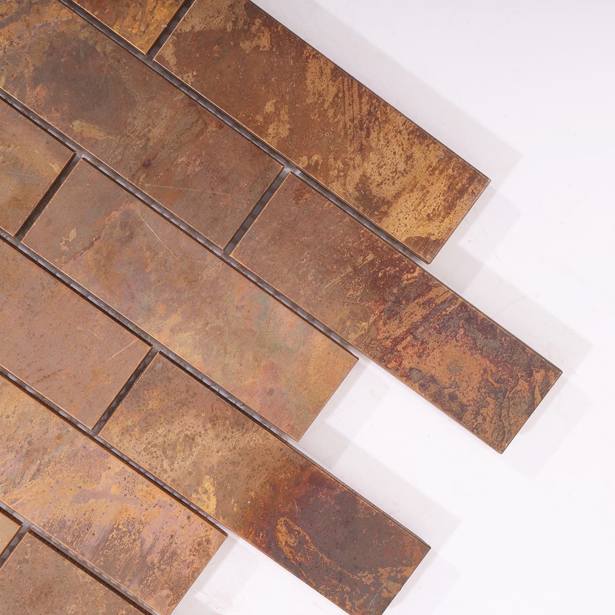 Corner detail of rustic copper brick mosaic tile