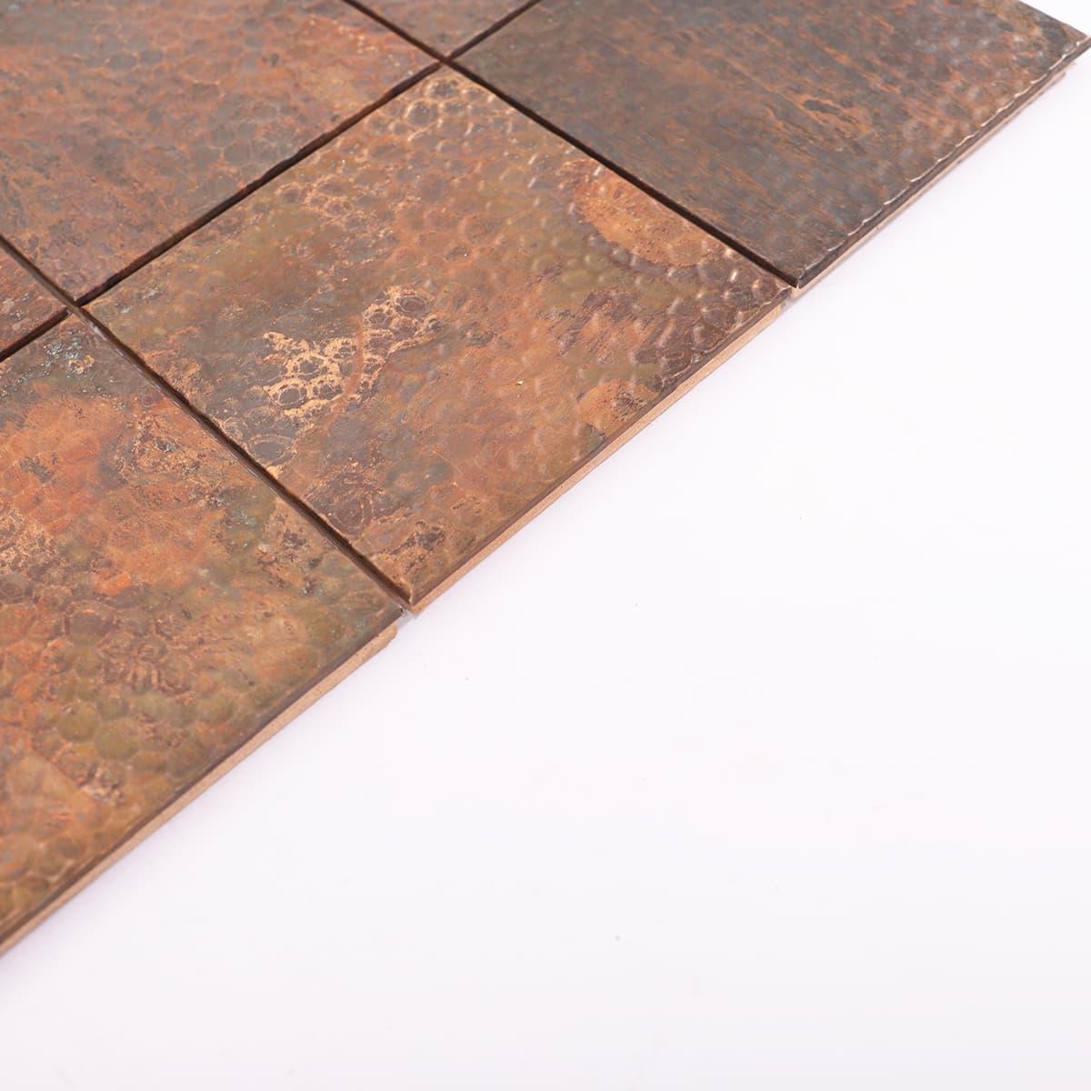 Edge detail of rustic hammered copper mosaic