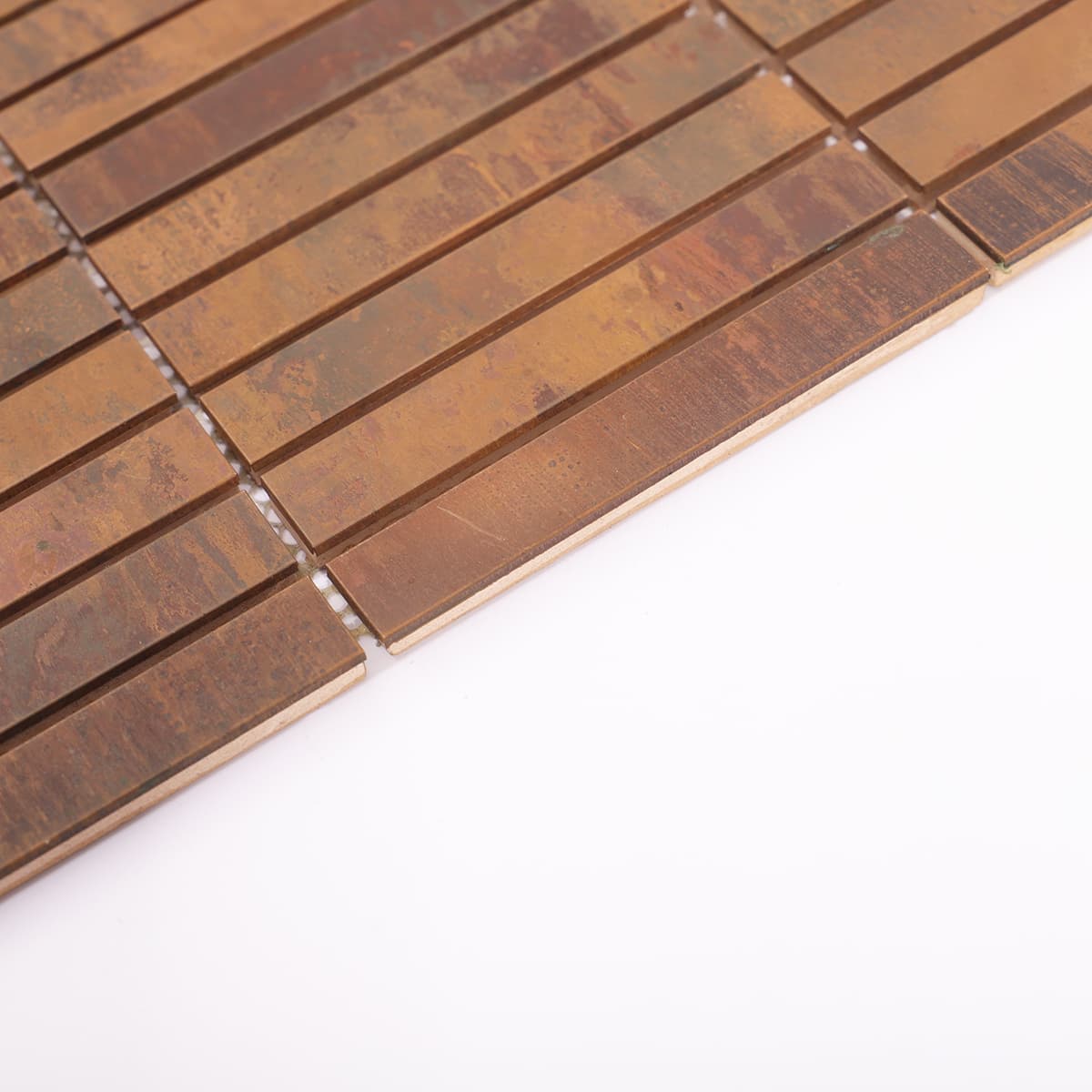 Side view of rustic copper thin strip mosaic tiles