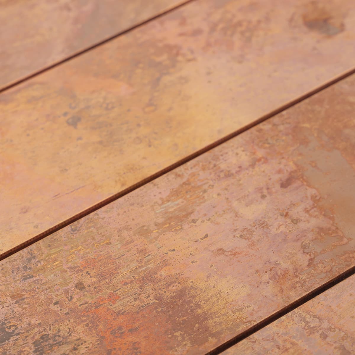 Rustic finish copper tiles with multi-tone pattern
