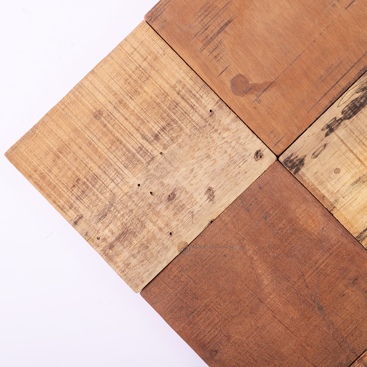 Lower left corner of wood mosaic with textured grain and warm tones

