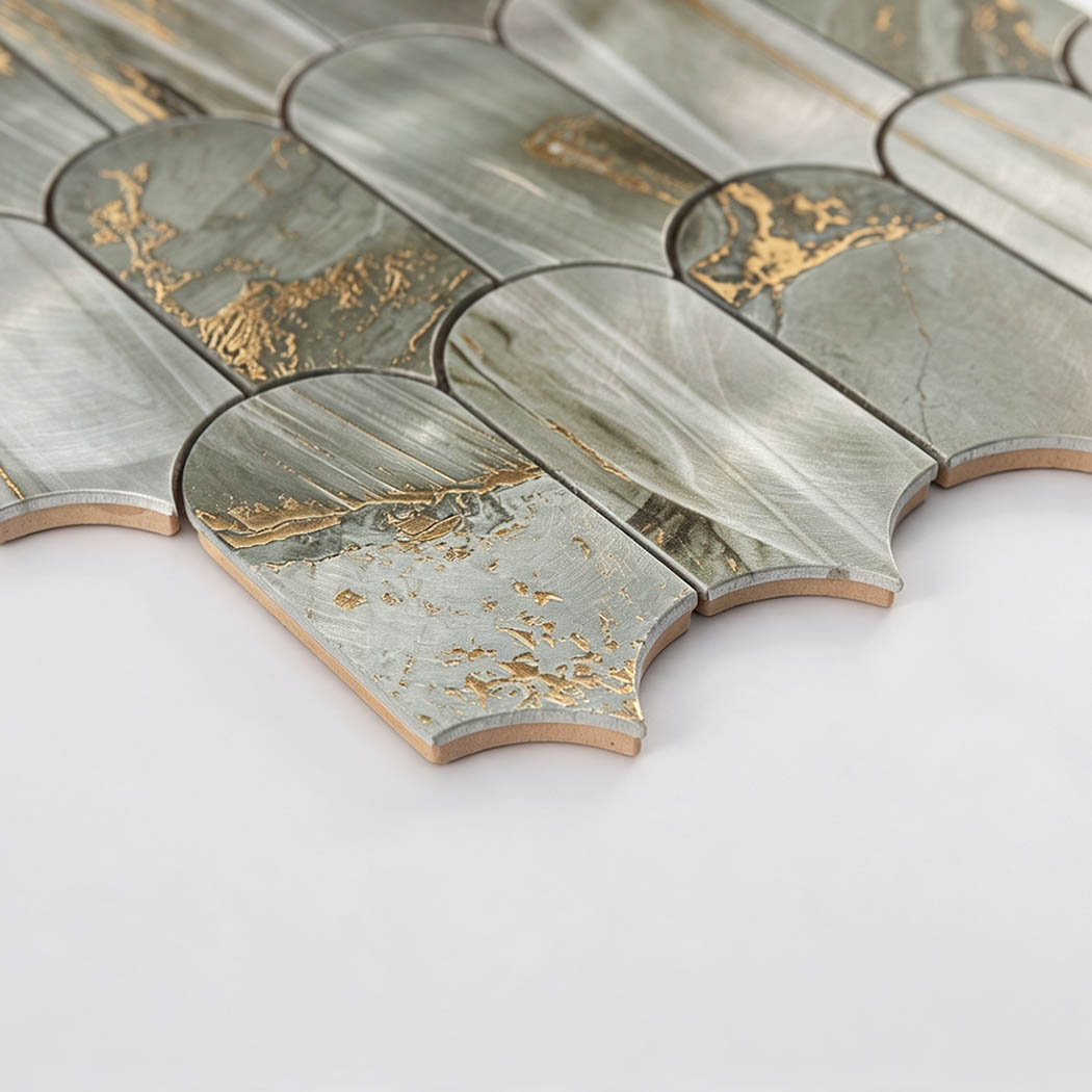 Side view of curved bottom edge on sage green gold fish scale tile