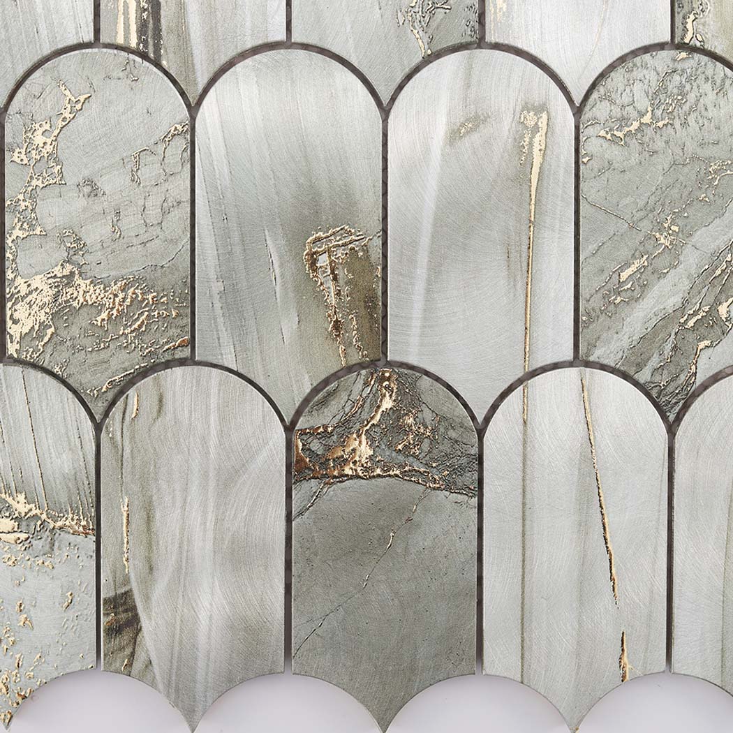 Gold crackle vein detail on sage green fish scale tile surface