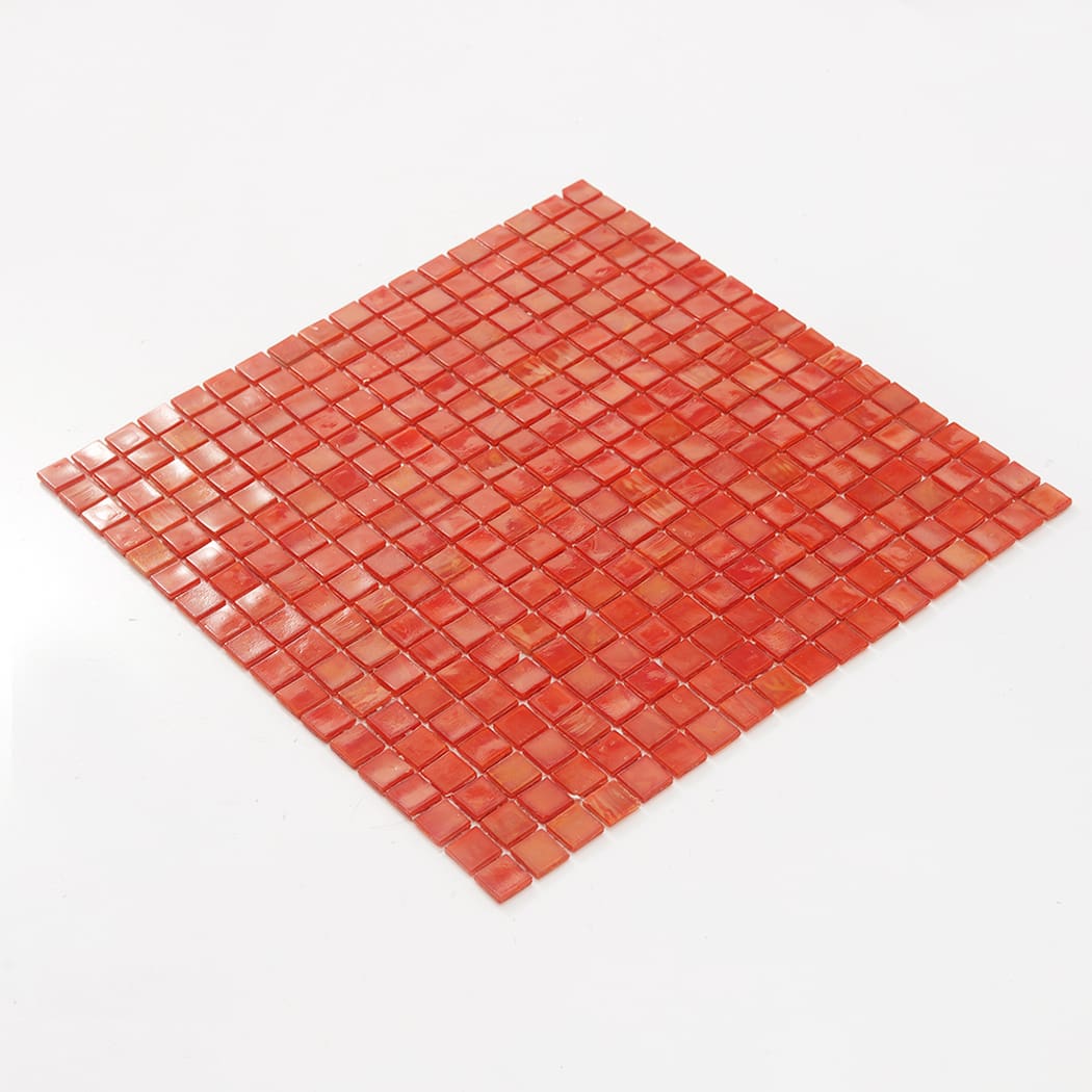 Angled view of a full salmon red square glass mosaic tile sheet