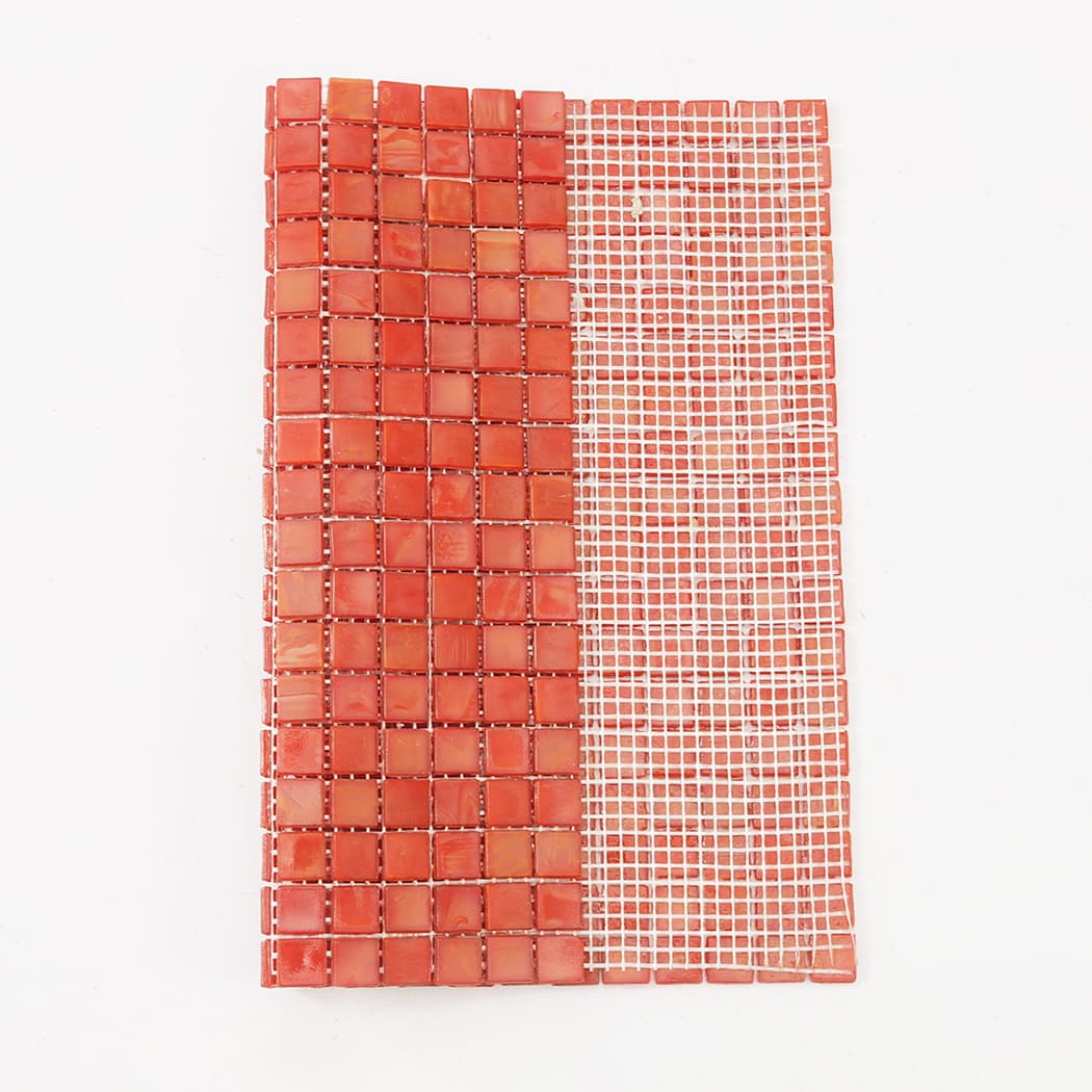 Salmon red square glass mosaic tile sheet showing front and mesh backing