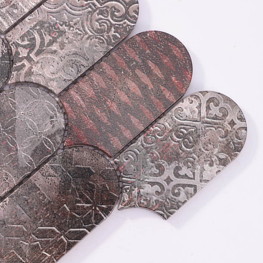  Close-up of corner tiles showing intricate embossed metal textures