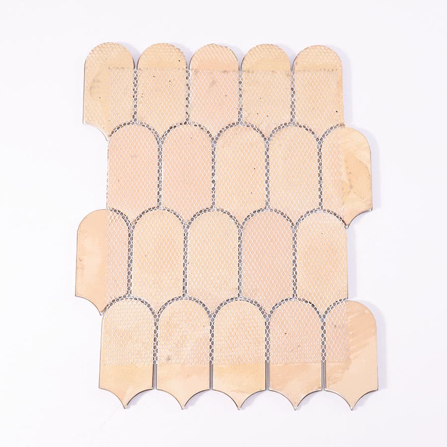 Backside of blue marble scallop mosaic tile with mesh for easy installation