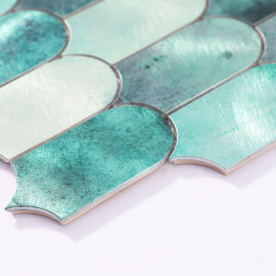  Angled side view of aqua green scallop tile showing brushed texture