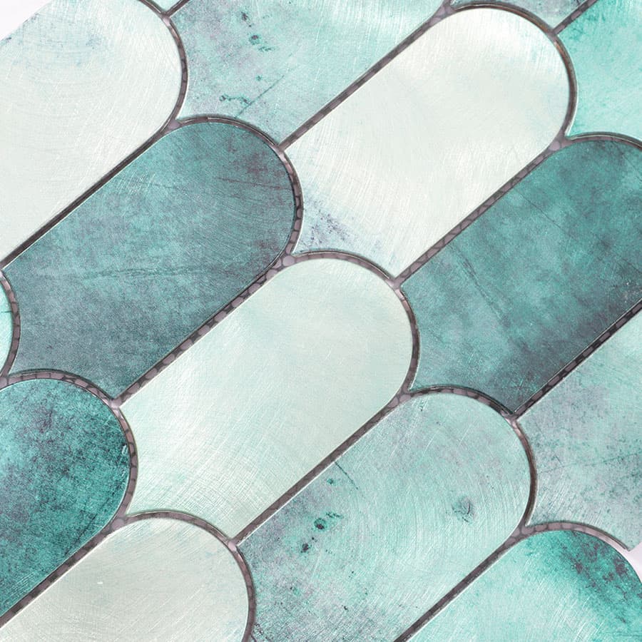  Macro view of brushed aluminum scallop tile with green gradient tones