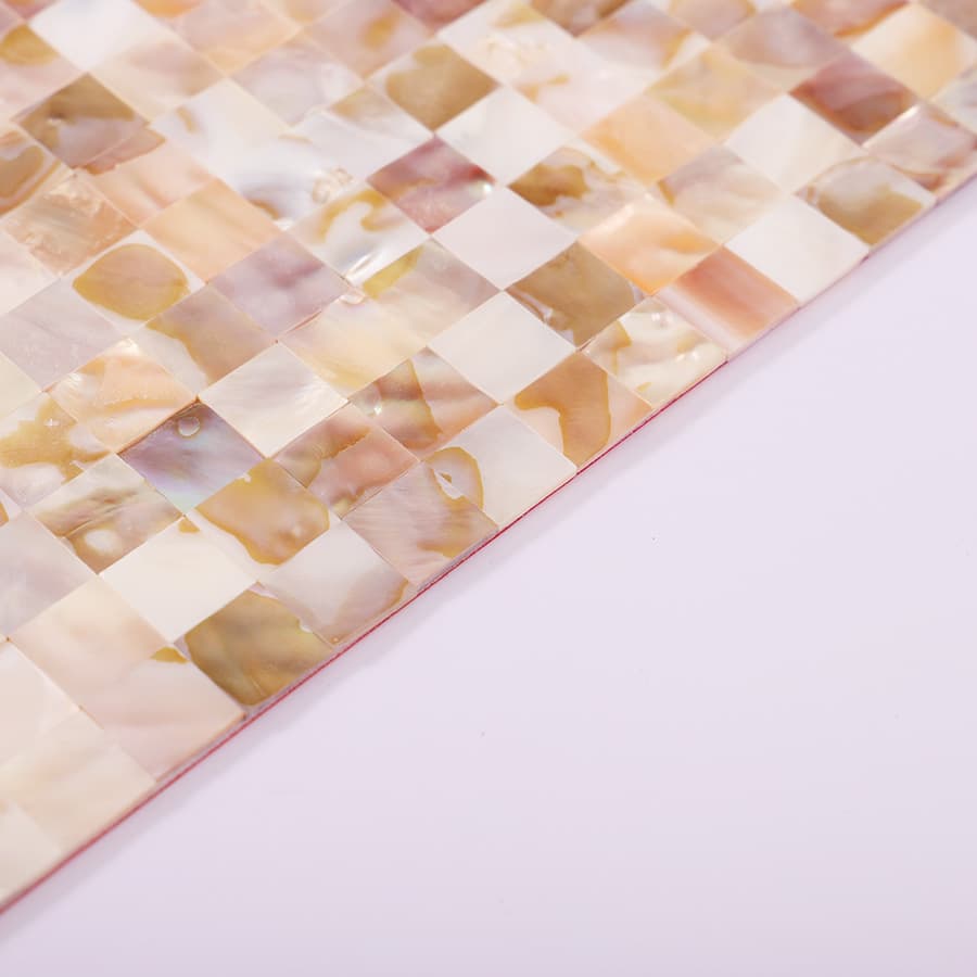 Angled edge view of iridescent shell mosaic highlighting finish and thickness