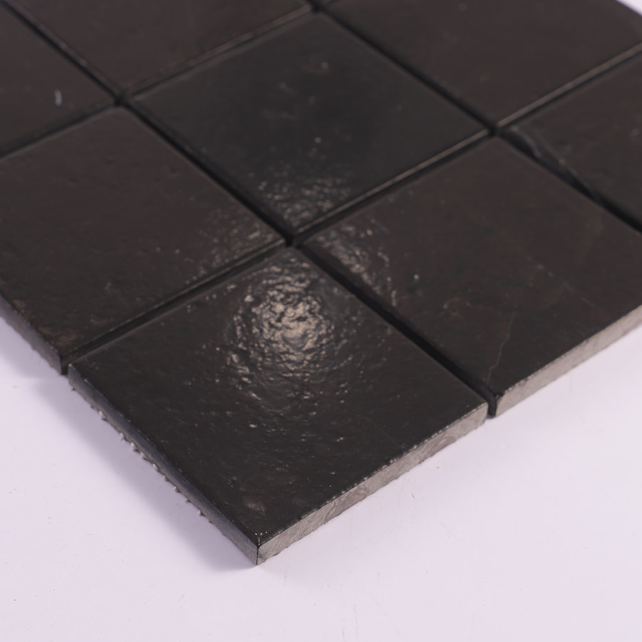 Side view of black stone mosaic tile sheet