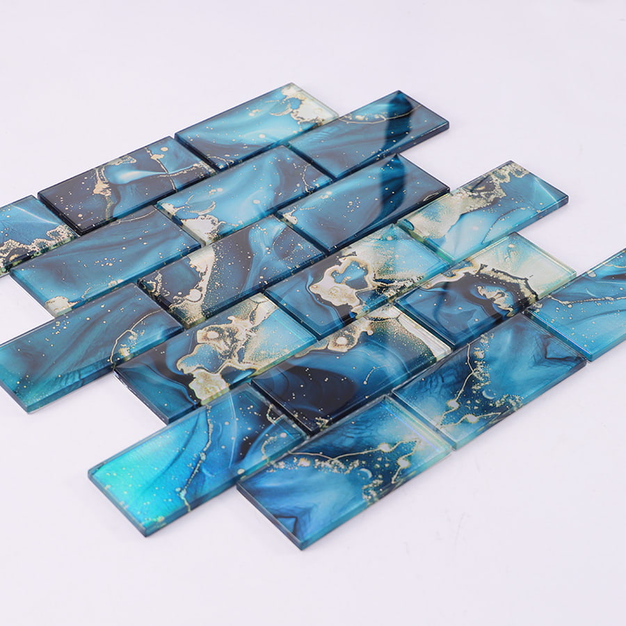 Angled view of blue glass mosaic tile sheet showing reflection and surface depth