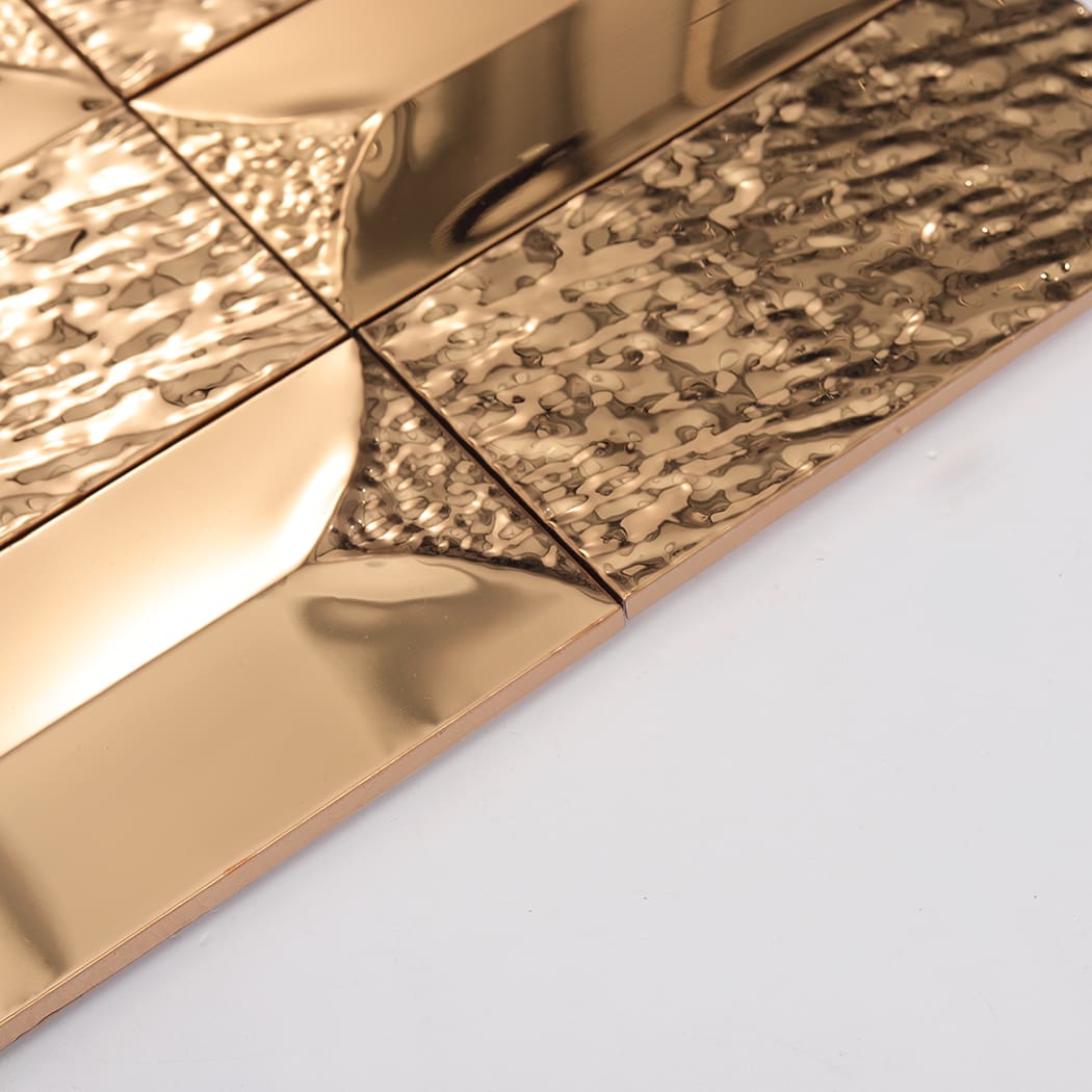 Side angle view showing the 3d thickness of rose gold rectangle metal tiles.
