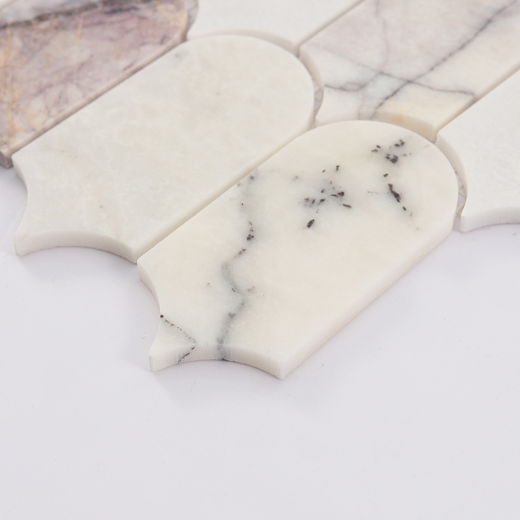 Side view of white gray arched marble mosaic tile showing natural stone thickness