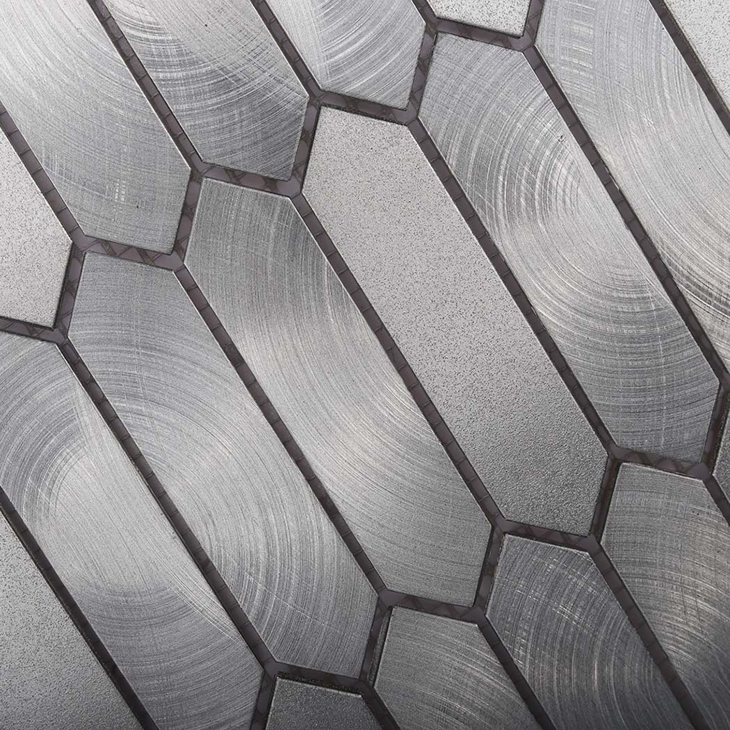 Close view of circular brushed grain on silver aluminum mosaic tile