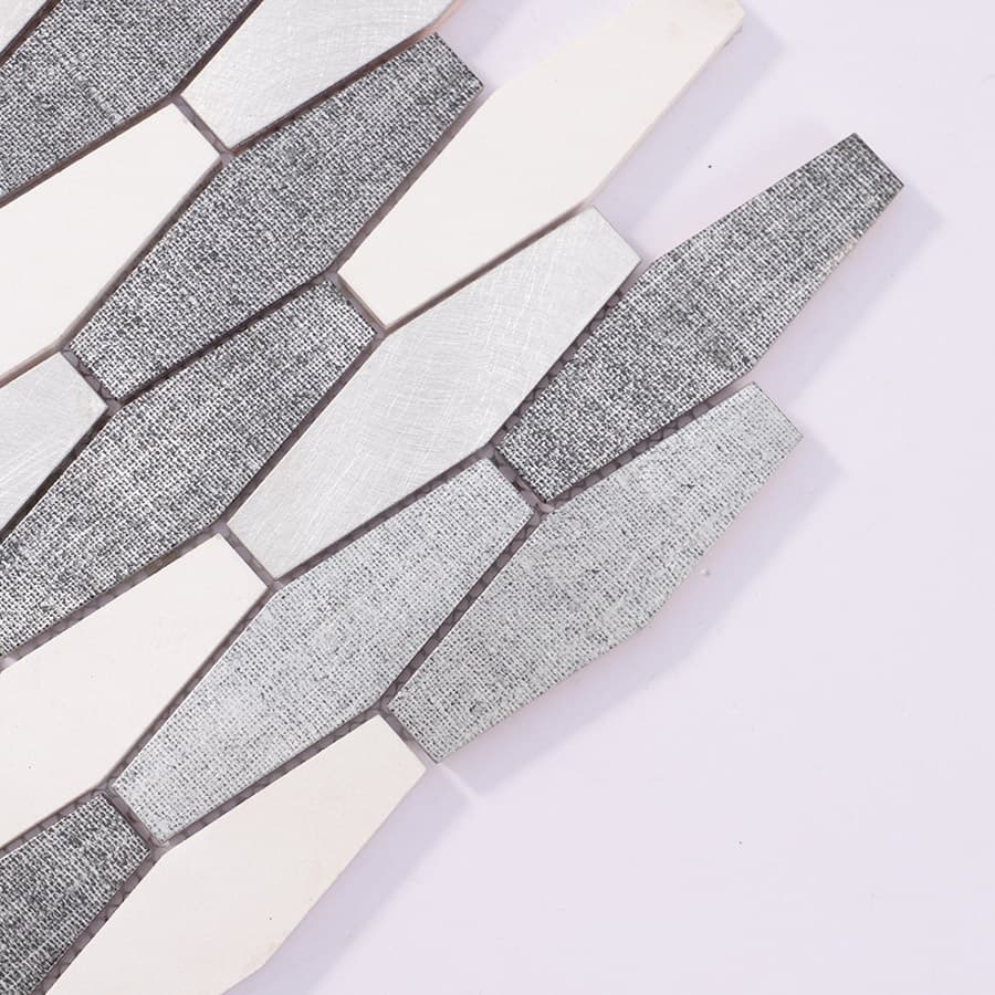 Angled close-up of silver brushed aluminum diamond tiles