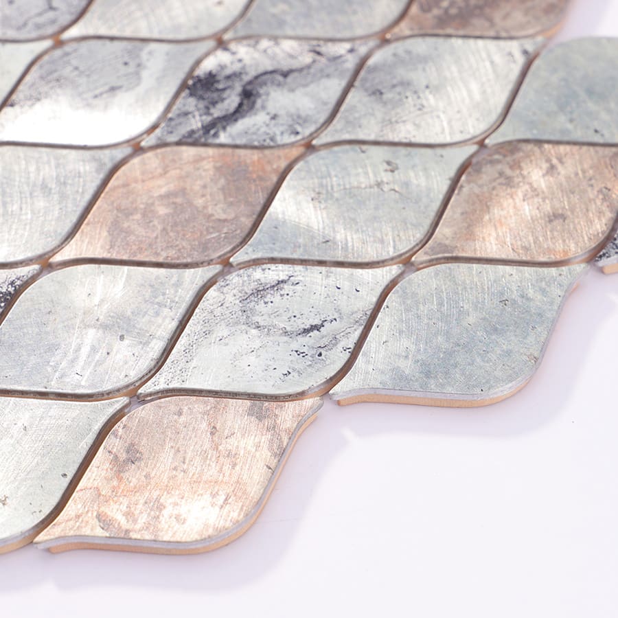 Side profile view of silver and bronze leaf mosaic tile