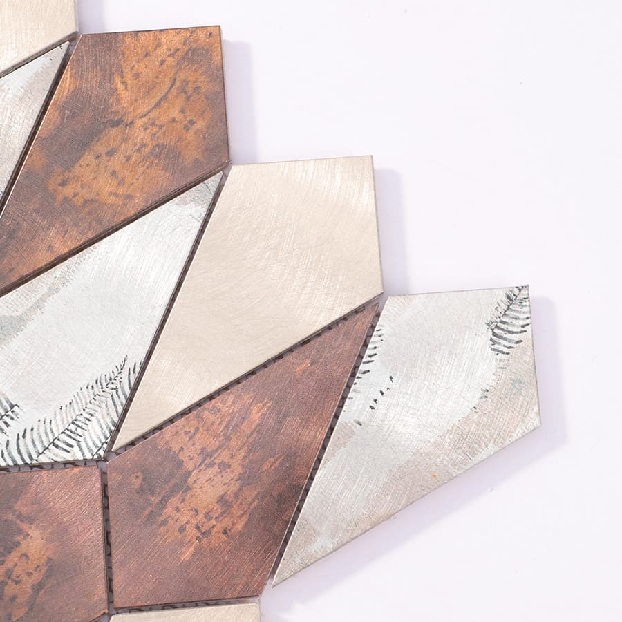Corner close-up of silver and copper diamond aluminum mosaic tile