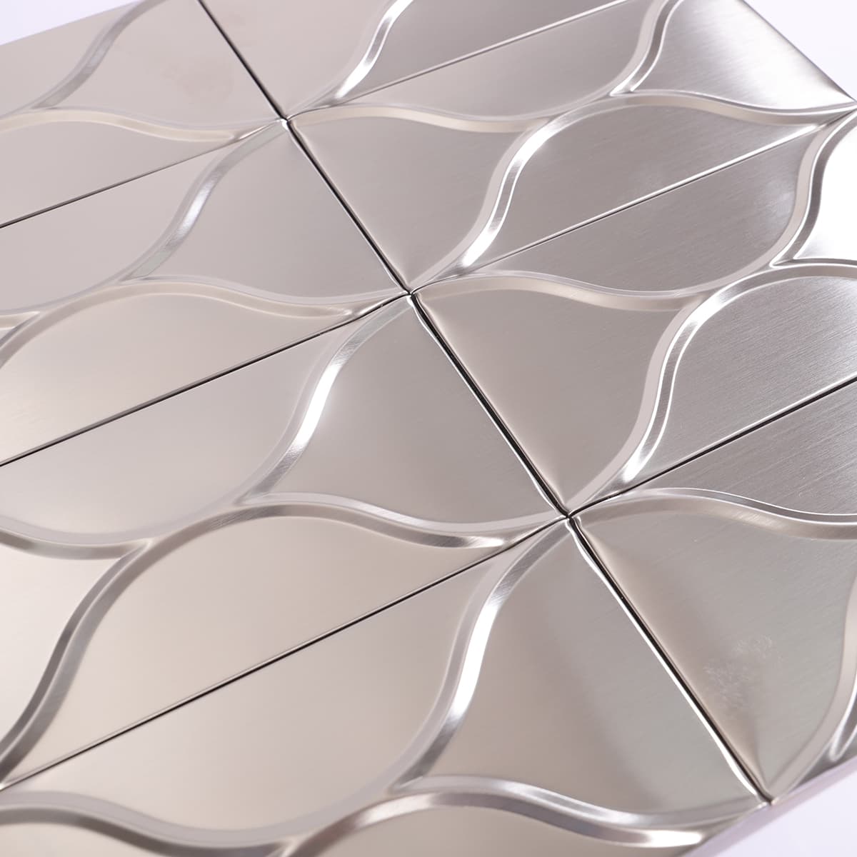 Light reflecting brushed stainless steel wave tile