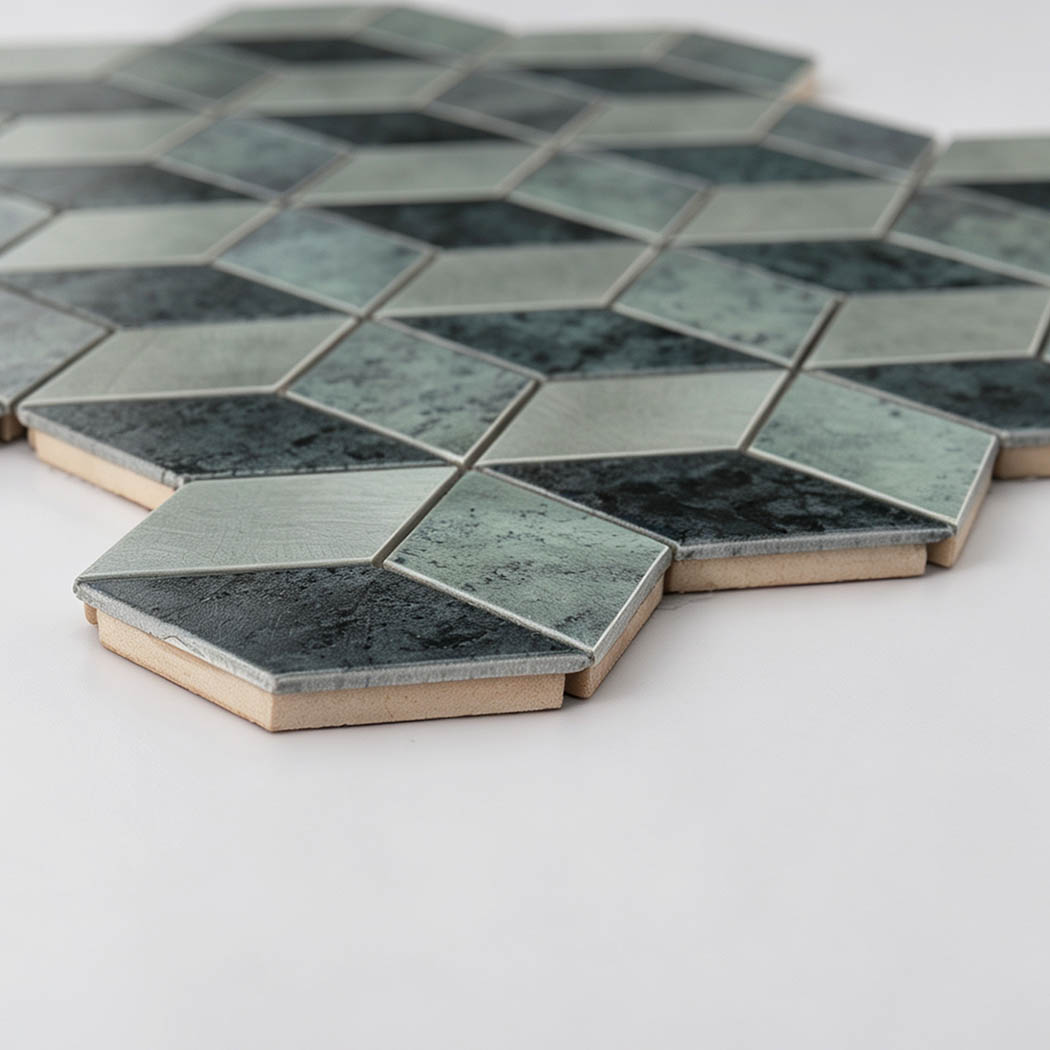 Angled view showing the thickness of silver and gray hexagon aluminum mosaic tile