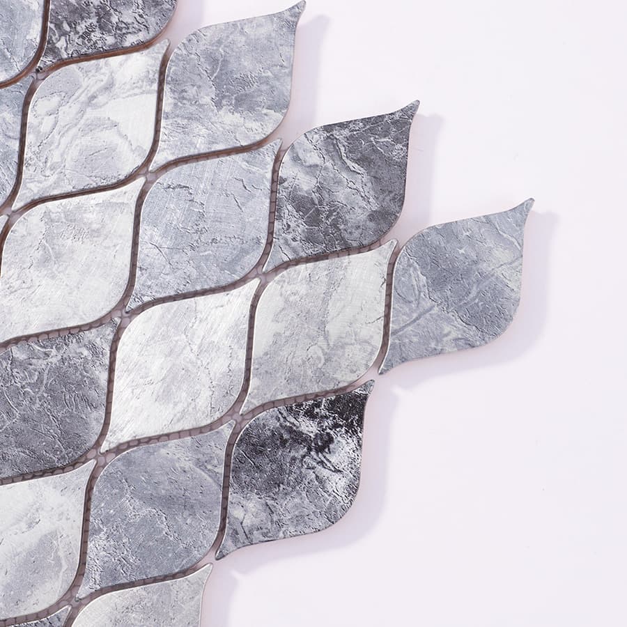 Close-up corner of silver gray aluminum leaf mosaic tile