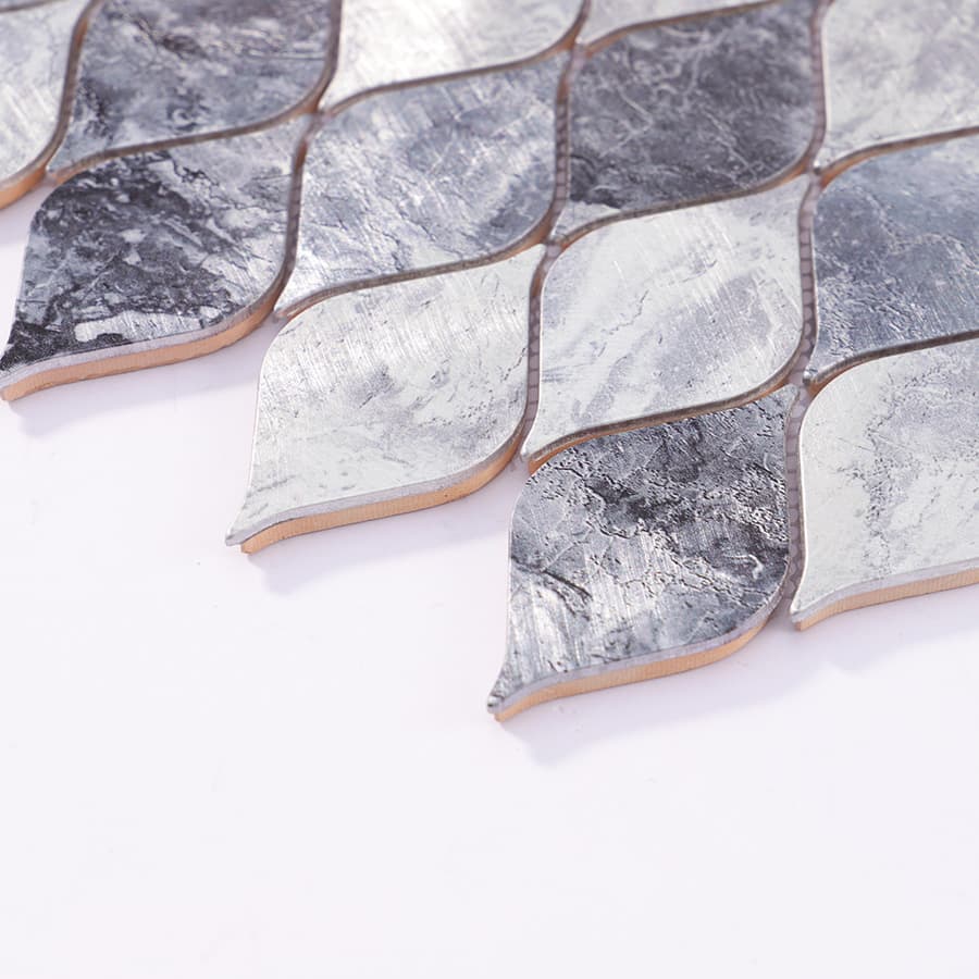 Side profile view of silver gray aluminum leaf mosaic tile