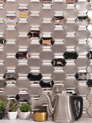 Vertical display of silver hexagon metal mosaic tiles showcasing reflective facets