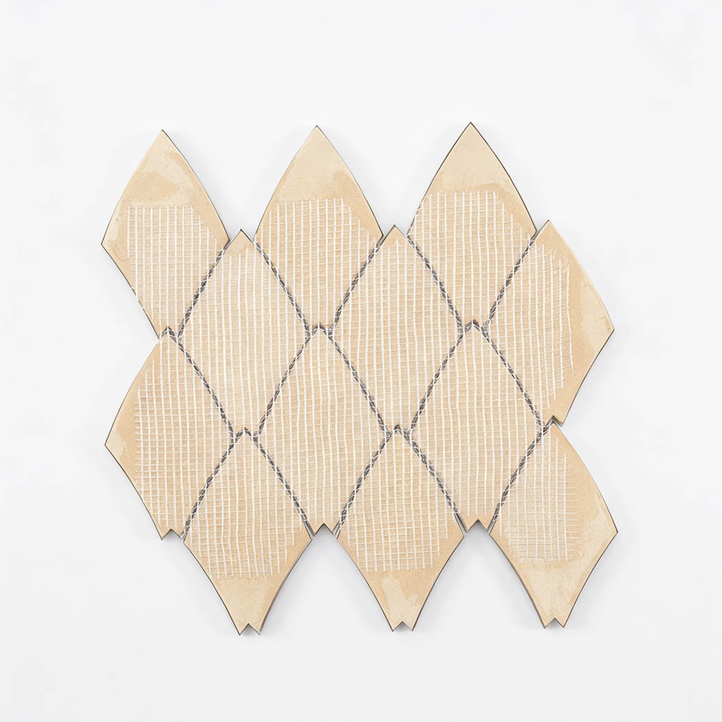 Back view of silver leaf shape aluminum tile with mesh backing