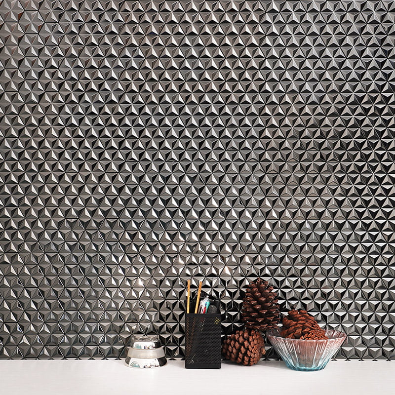 Square close‑up of silver 3D hexagon metal mosaic tile wall.