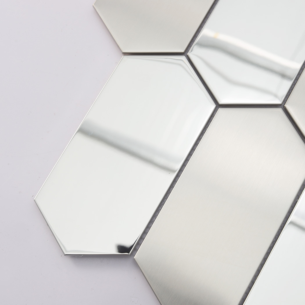 Close up detail showing the reflective silver finish and edges of an elongated hexagonal tile.