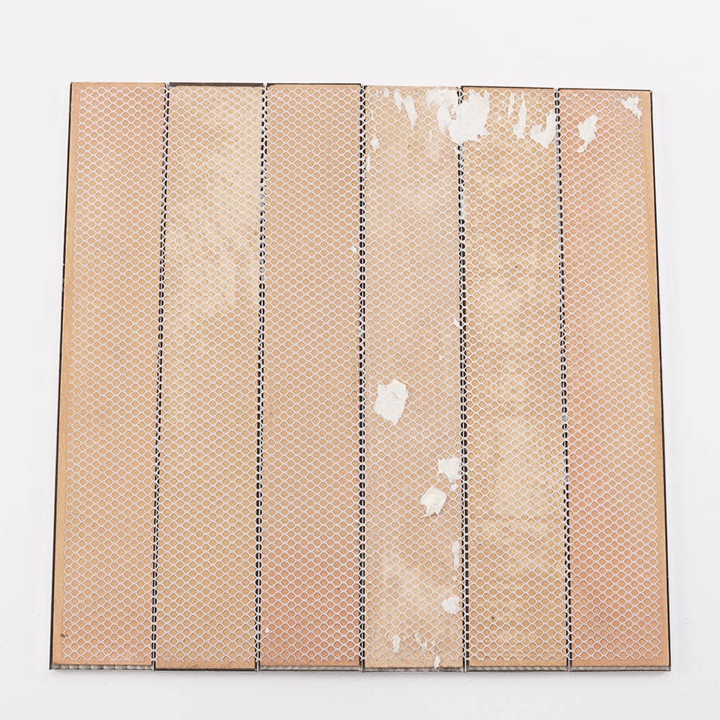 Back view of silver mirror stainless steel vertical tile sheet with mesh backing