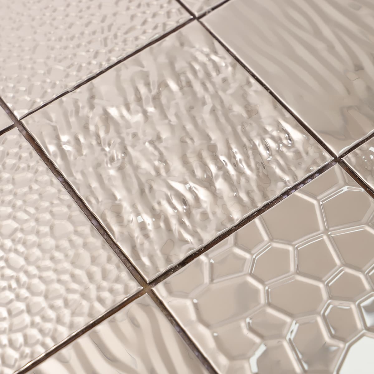 Side view of silver metallic mixed texture mosaic tile