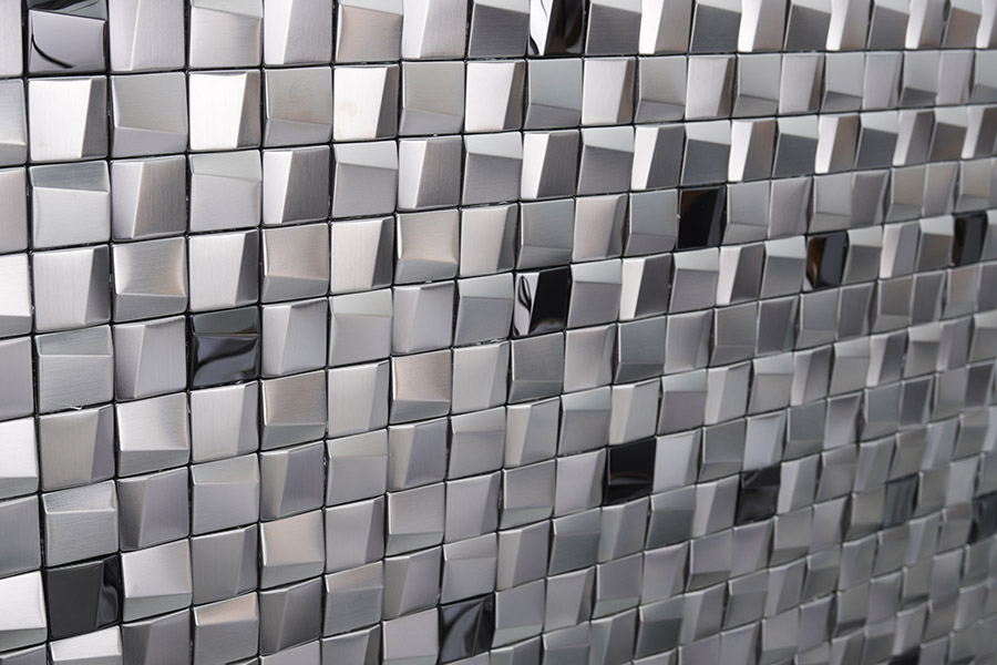Close-up of silver square metal mosaic wall tiles with mixed brushed and mirror finish
