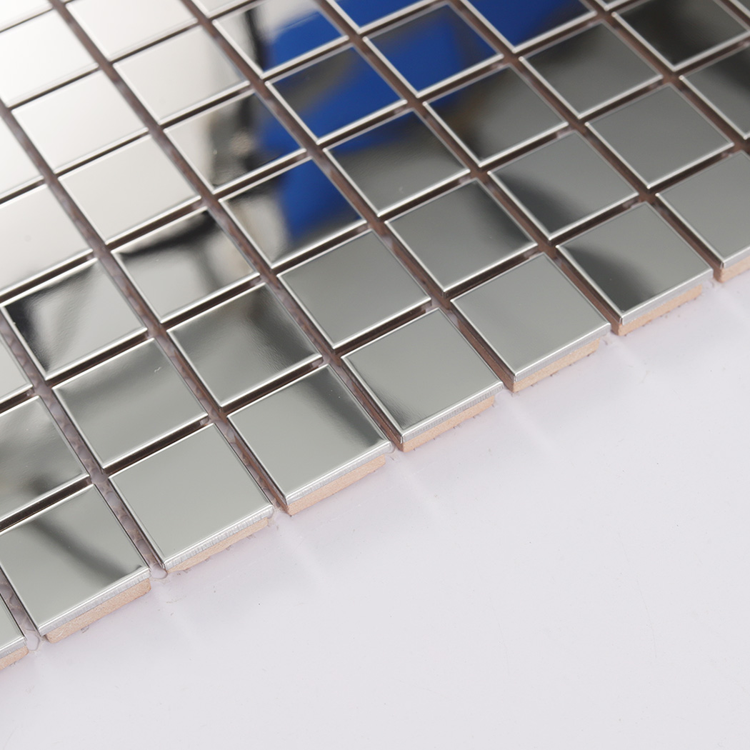 Side detail of silver square mirror metal mosaic showing tile thickness