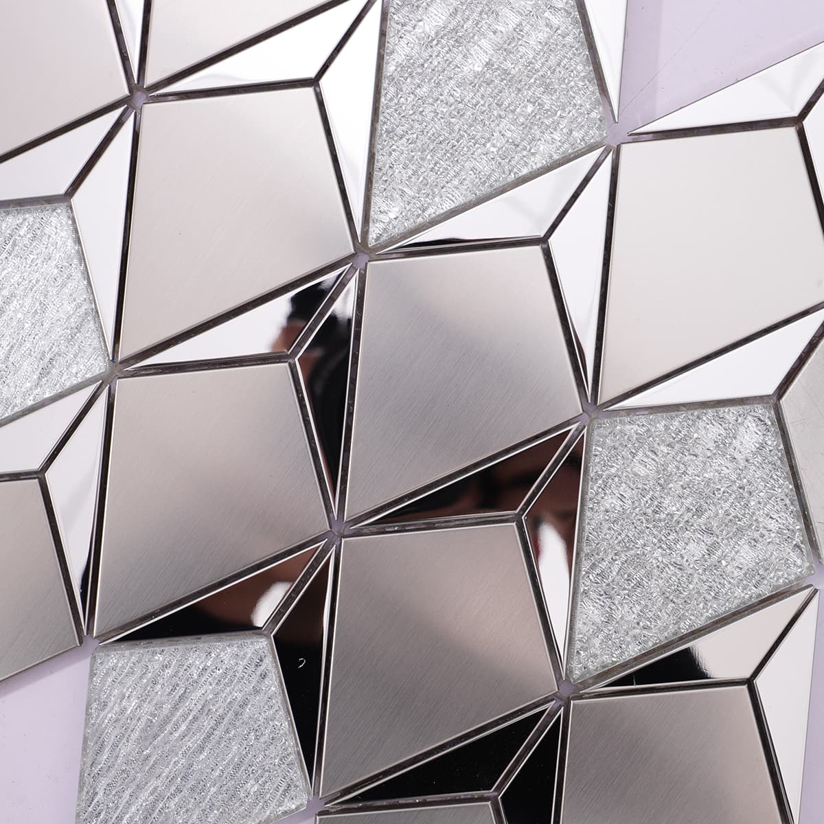 Close-up of silver stainless steel and textured glass mosaic