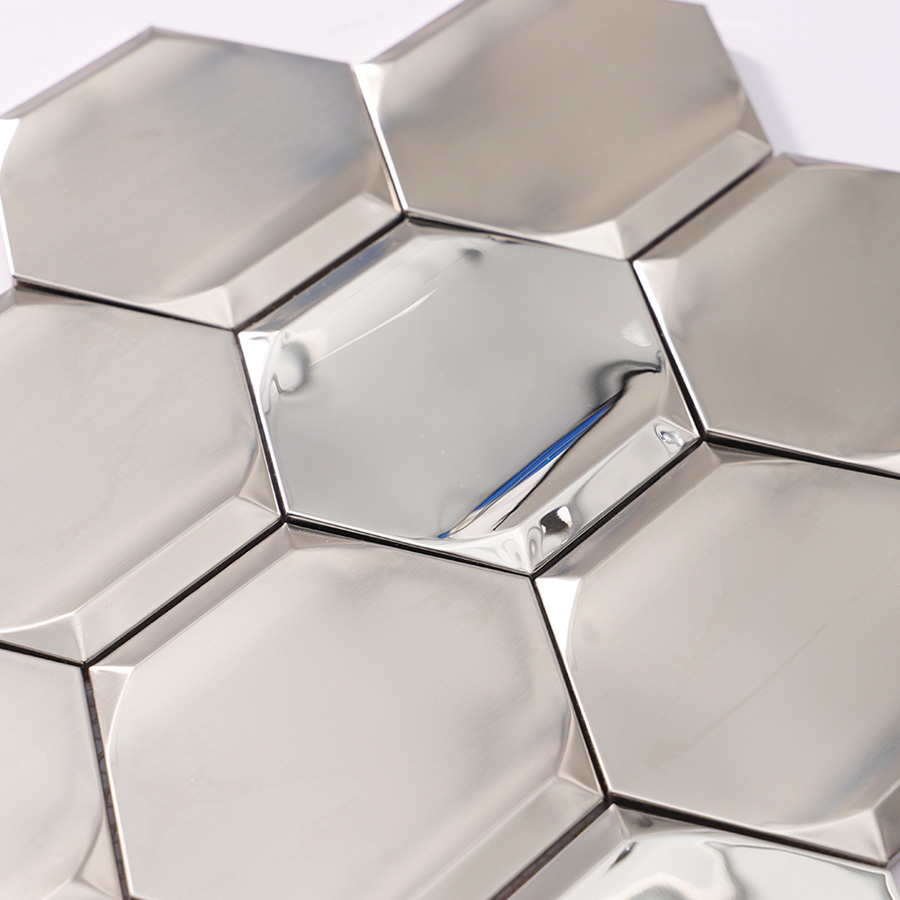 Texture detail of silver stainless steel hexagon 3D wall tile showing brushed finish.
