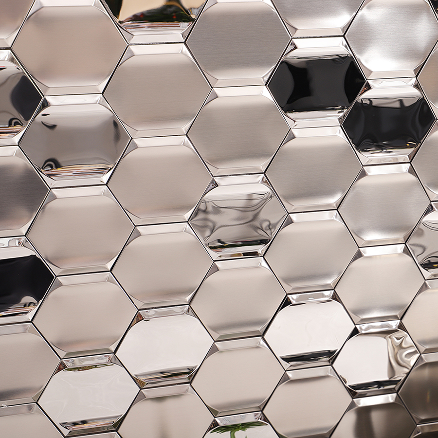 Installed silver stainless steel hexagon wall mosaic with reflective 3D surface.
