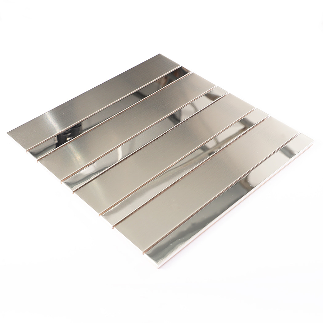 Angled layout of silver stainless steel linear mosaic tile for wall installation