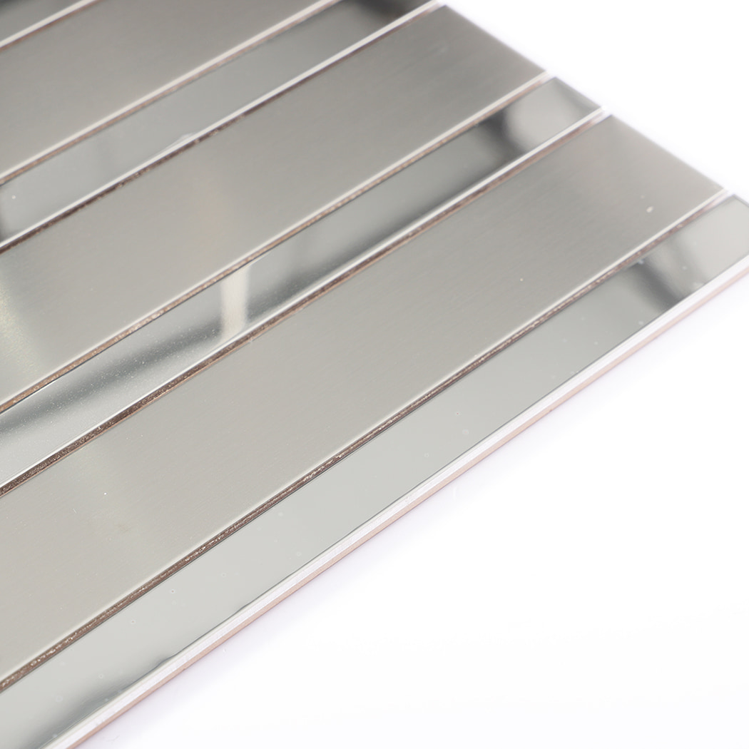 Edge view of sleek silver stainless steel mosaic tile with reflective finish